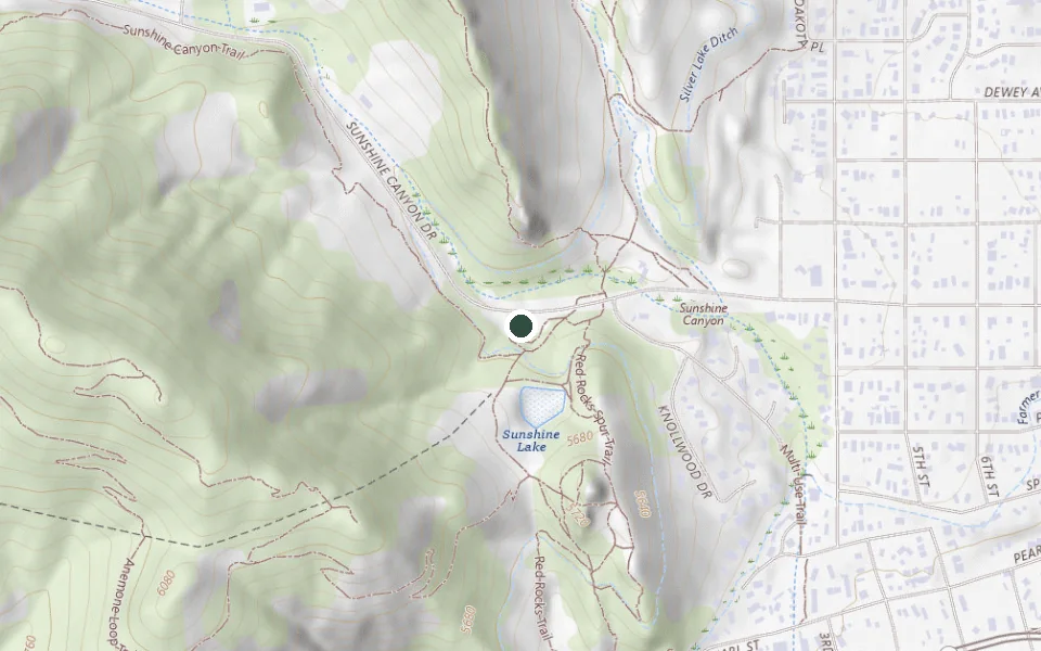 USGS topographic map of the Centennial Trailhead on Sunshine Canyon Drive, with the trailhead marked and the Mount Sanitas and Red Rocks trails visible.